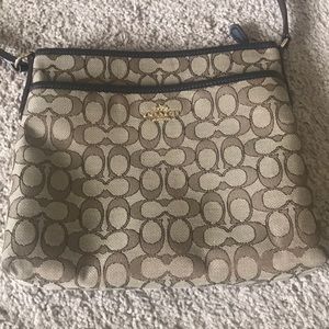 Coach Signature Crossbody in brown.